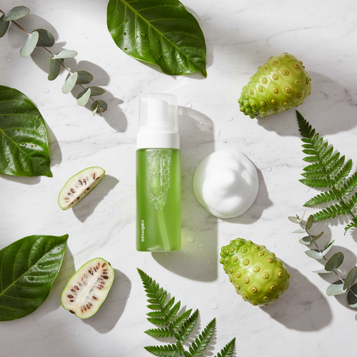 Celimax noni cleanser flat lay with botanicals